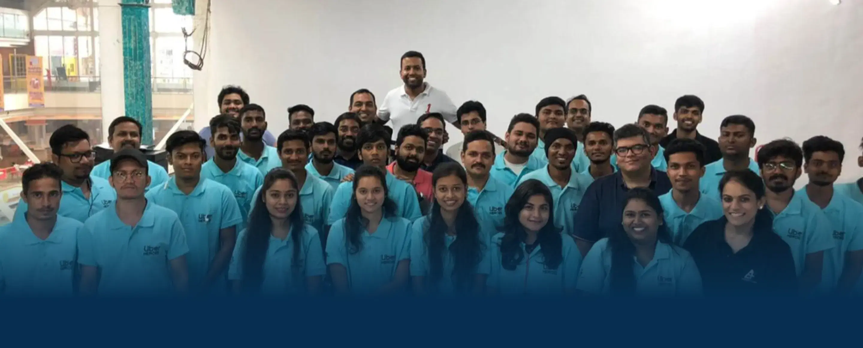 The Everest Fleet team standing together in matching blue T-shirts