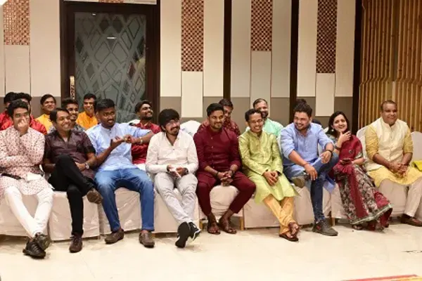 The team seated together at an annual event